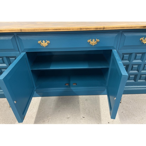 1356 - A modern solid wood sideboard with natural wood top and teal painted base. 4 cupboards to base with ... 