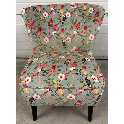 1357 - A modern curve backed easy chair with splayed screw in legs and colourful upholstery with bird desig... 