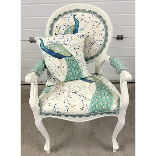 1358 - A modern bedroom armchair, painted white, with peacock design upholstery and matching cushion.