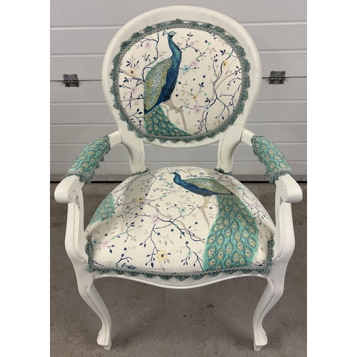 1358 - A modern bedroom armchair, painted white, with peacock design upholstery and matching cushion.