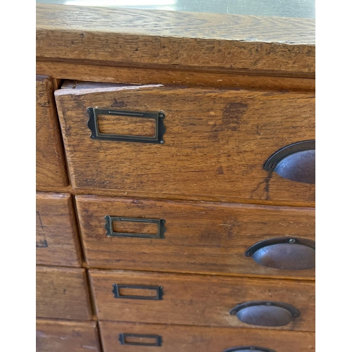 1362 - An early 20th century haberdashery shop counter with glass panel front, top & sides. Raised on turne... 