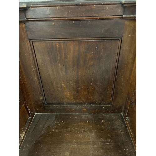 1365 - A pair of antique dark oak church sideman's pew chairs. With panelled backs and shaped arms. Each ap... 