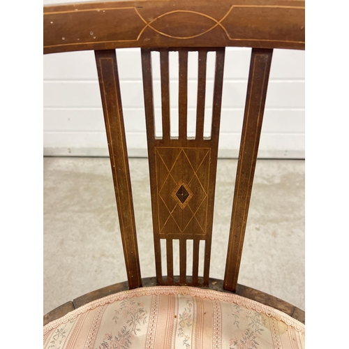 1380 - A Victorian dark wood curve backed chair with spindle supports and inlaid detail to panels and back.... 