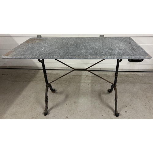 1386 - A vintage cast metal based rectangular garden table with marble top. Top has crack (approx. 28cm lon... 