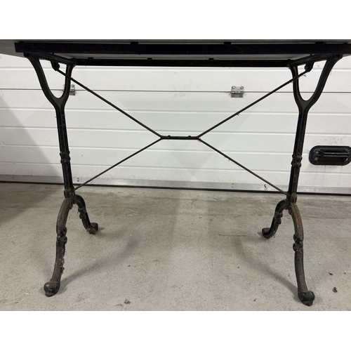 1386 - A vintage cast metal based rectangular garden table with marble top. Top has crack (approx. 28cm lon... 