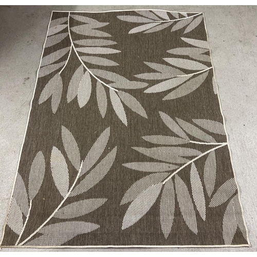 1388 - A modern reversible rug with foliate design in neutral tones. Approx. 222cm x 160cm.