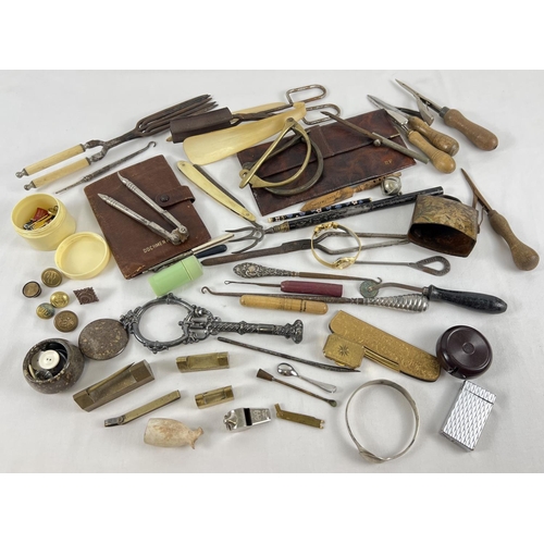 1290 - A collection of assorted vintage items to include button hooks, curling tongs, buttons, leather wall... 