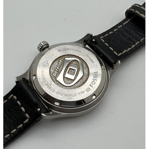 1157 - A men's Defender wristwatch by Fossil, DEC1001 111407. Stainless steel case with black face. Luminou... 