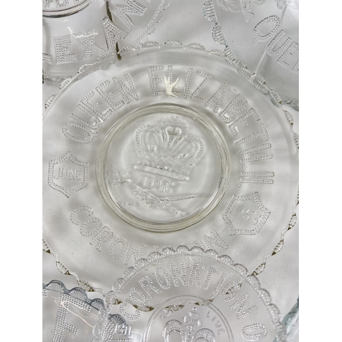 1235 - A collection of 9 moulded glass coronation plates together with 2 antique ceramic jugs. Commemorativ... 