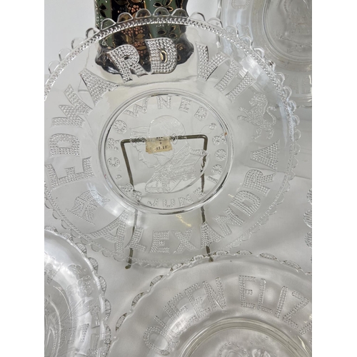 1235 - A collection of 9 moulded glass coronation plates together with 2 antique ceramic jugs. Commemorativ... 