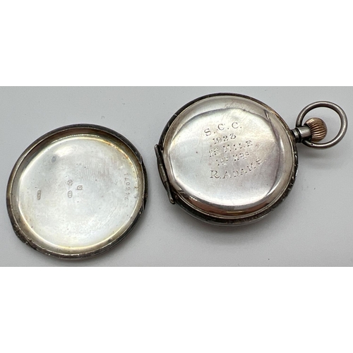 1168 - A vintage silver pocket watch with secondary dial. White enamel face with black steel hands Back nee... 