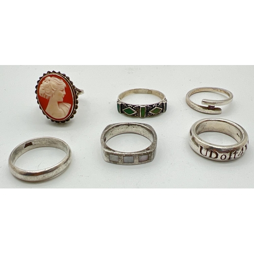 1067 - 6 silver dress rings in varying designs to include a cameo set ring and band style rings. All marked... 