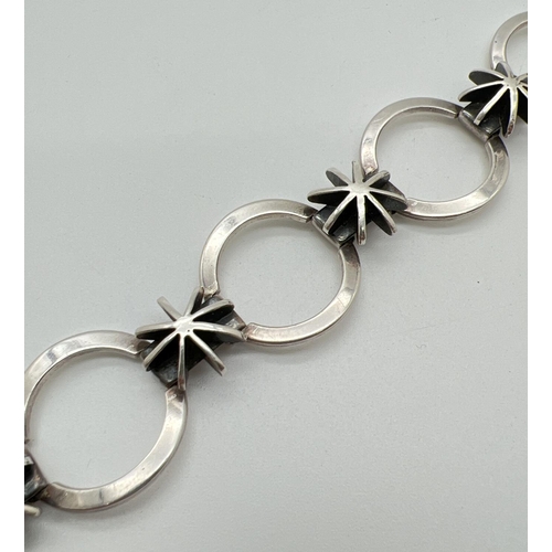 1072 - A 925 silver modern design star and circle link bracelet with push bar clasp and safety clip. Silver... 