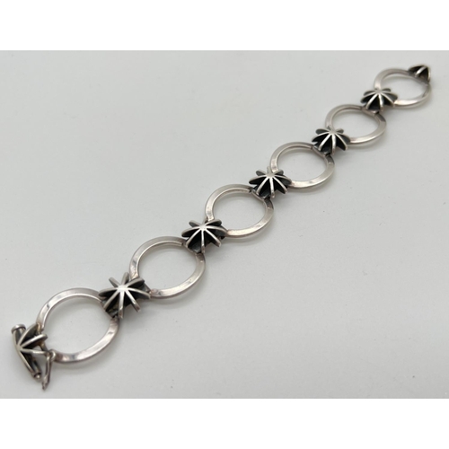 1072 - A 925 silver modern design star and circle link bracelet with push bar clasp and safety clip. Silver... 