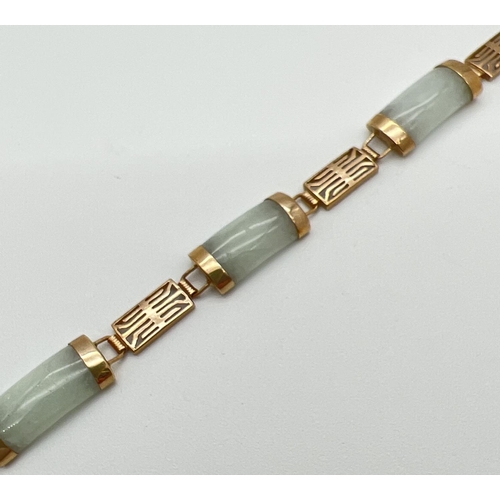 1089 - A 9ct gold and green jade panel bracelet with push clasp. Alternating rectangular pierced work chine... 