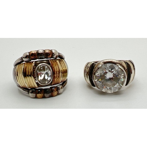 1094 - 2 band style silver dress rings with gold accents, set with central clear stones. One marked 925 and... 