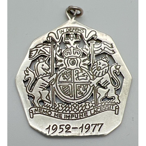 1097 - A large pierced work Queen Elizabeth Silver Jubilee pendant. Hallmarked to reverse for Edinburgh 197... 