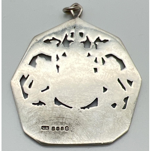 1097 - A large pierced work Queen Elizabeth Silver Jubilee pendant. Hallmarked to reverse for Edinburgh 197... 