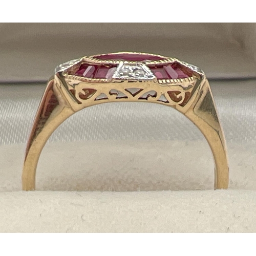 1099 - An Art Deco style ruby and diamond set dress ring by Luke Stockley, London. A marquise cut central r... 