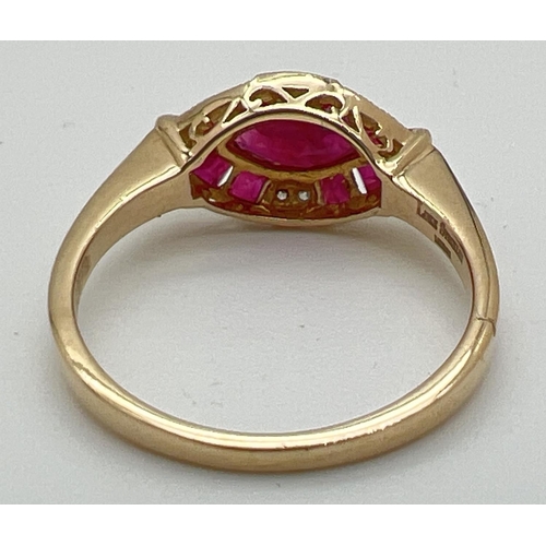 1099 - An Art Deco style ruby and diamond set dress ring by Luke Stockley, London. A marquise cut central r... 