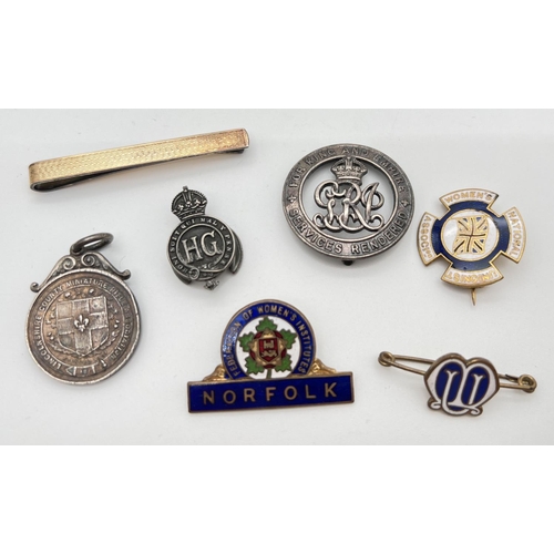 1293 - A collection of vintage badges, a medallion and a tie pin. To include a 1907 Rifle Association medal... 