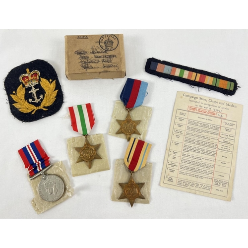 1202 - WWII medal group of 4 medals together with 2 period cloth badges. Medals comprise: 1939-45 War Medal... 