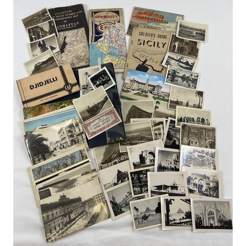 1203 - A collection of assorted WWII era photographs, postcards and ephemera. To include photographs of Egy... 