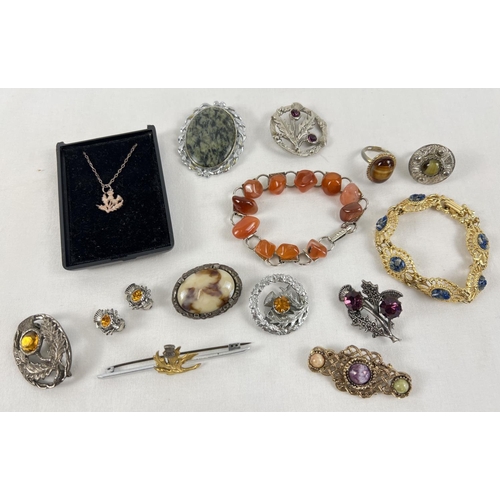 1111 - A collection of Scottish costume jewellery items, many natural stone set, to include Miracle. Lot in... 