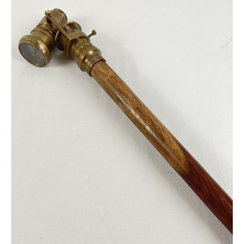 1296 - A reproduction wood and brass walking stick with swivel top telescope/compass handle. Approx. 95.5cm... 