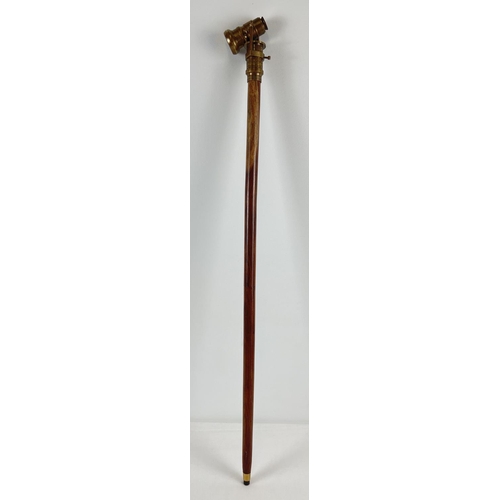 1296 - A reproduction wood and brass walking stick with swivel top telescope/compass handle. Approx. 95.5cm... 