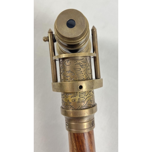 1296 - A reproduction wood and brass walking stick with swivel top telescope/compass handle. Approx. 95.5cm... 