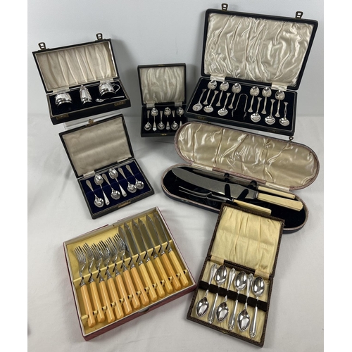 1197 - 7 boxed vintage cutlery and table ware sets. To include Art Deco style teaspoon set complete with su... 