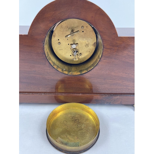 1208 - An early 20th century wooden cased mantel clock with a Swiss movement. In working order, with Roman ... 