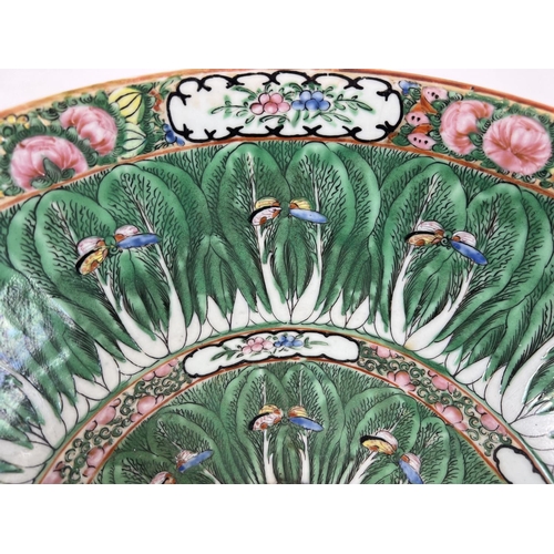 1249 - A 20th century oriental large bowl in famille verte, with butterfly detail. Stamp to base. Approx. 3... 