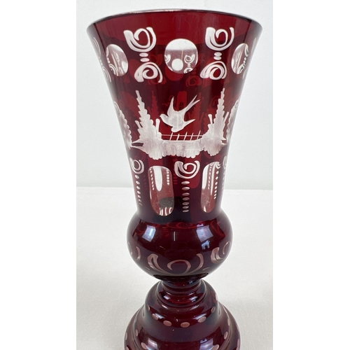 1241 - A vintage Czechoslovakian Bohemian style etched vase with ruby coloured overlay. By Egermann, comple... 