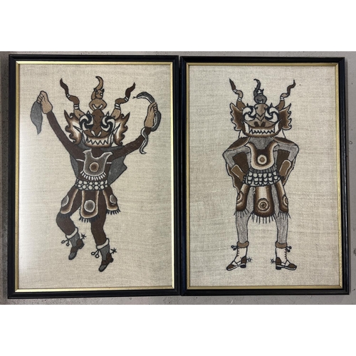 1250 - 2 framed and glazed tapestry wool panels depicting tribal figures. Frame size approx. 55cm x 38cm.