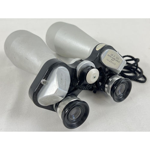 1274 - A pair of 12 x 50 extra wide angle coated optics binoculars, by Zenith, No. 281155. With neck cord.