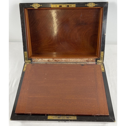 1301 - An antique coromandel wood writing box with brass inlay, in need of restoration. Interior writing sl... 