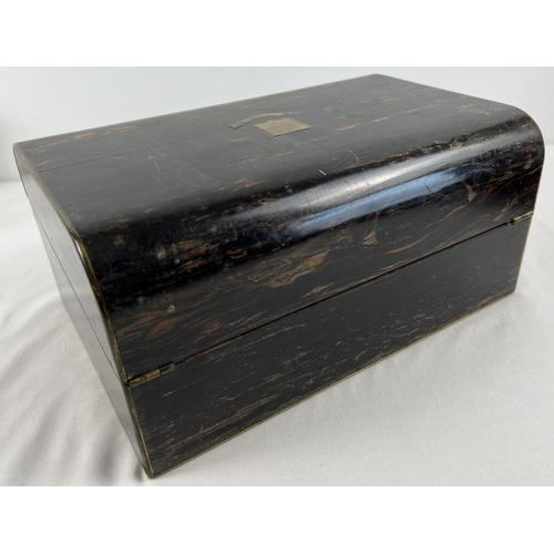 1301 - An antique coromandel wood writing box with brass inlay, in need of restoration. Interior writing sl... 