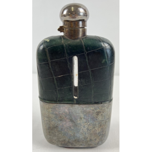 1191 - An antique silver plated and green leather covered hip flask. Hinged lid has twist lock feature. App... 