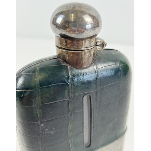 1191 - An antique silver plated and green leather covered hip flask. Hinged lid has twist lock feature. App... 