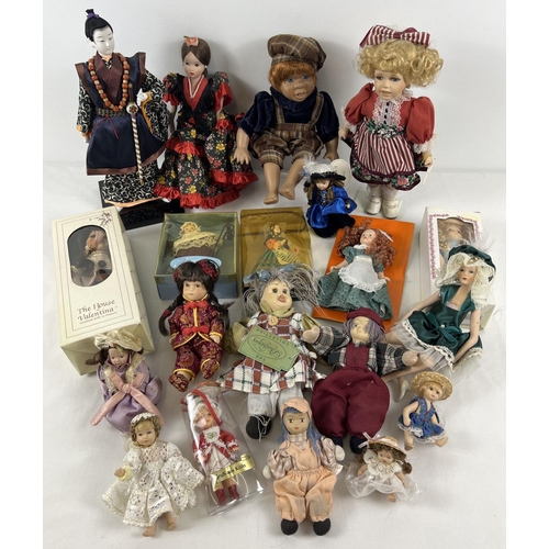 1313 - A box of assorted small and dolls house sized ceramic collectors dolls, some boxed.