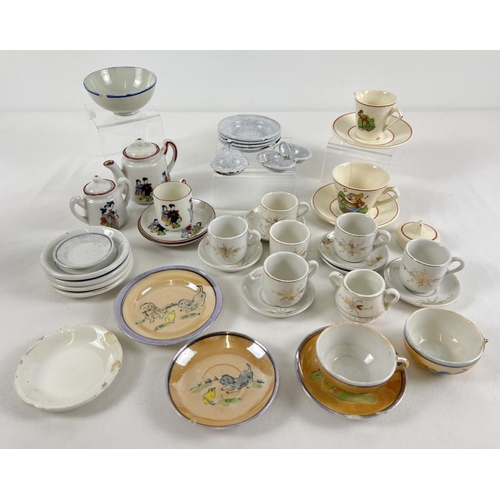 1314 - A collection of vintage ceramic and enamel childs/dolls tea set pieces, some a/f. To include: Walt D... 