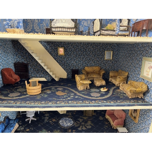 1315 - A large 3 storey fully furnished dolls house with a quantity of Westacre style dolls furniture. To i... 