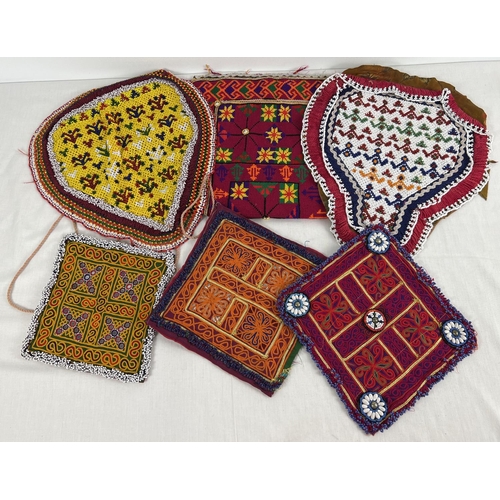 1374 - A collection of 6 vintage Central Asian heavily beaded and embroidered fabric panels. In varying siz... 