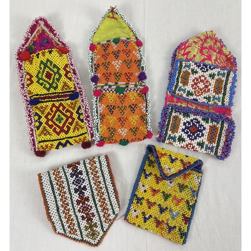 1376 - 5 Central Asian heavily beaded wrap pouches, in varying colours, sizes and designs.