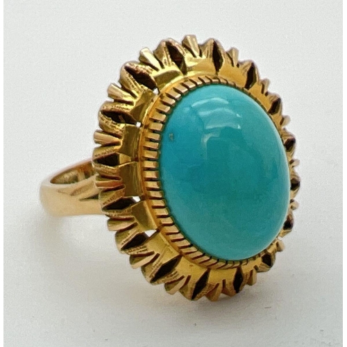 171 - A vintage Mexican 14k gold dress ring set with an oval cut cabochon of turquoise in a sunflower desi... 