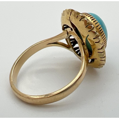 171 - A vintage Mexican 14k gold dress ring set with an oval cut cabochon of turquoise in a sunflower desi... 