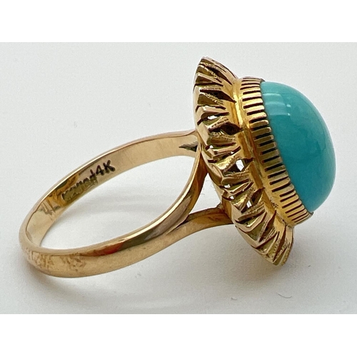 171 - A vintage Mexican 14k gold dress ring set with an oval cut cabochon of turquoise in a sunflower desi... 