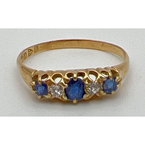 1003 - A vintage gypsy style 18ct gold sapphire and diamond set ring. Claw set mount with 3 sapphires and t... 